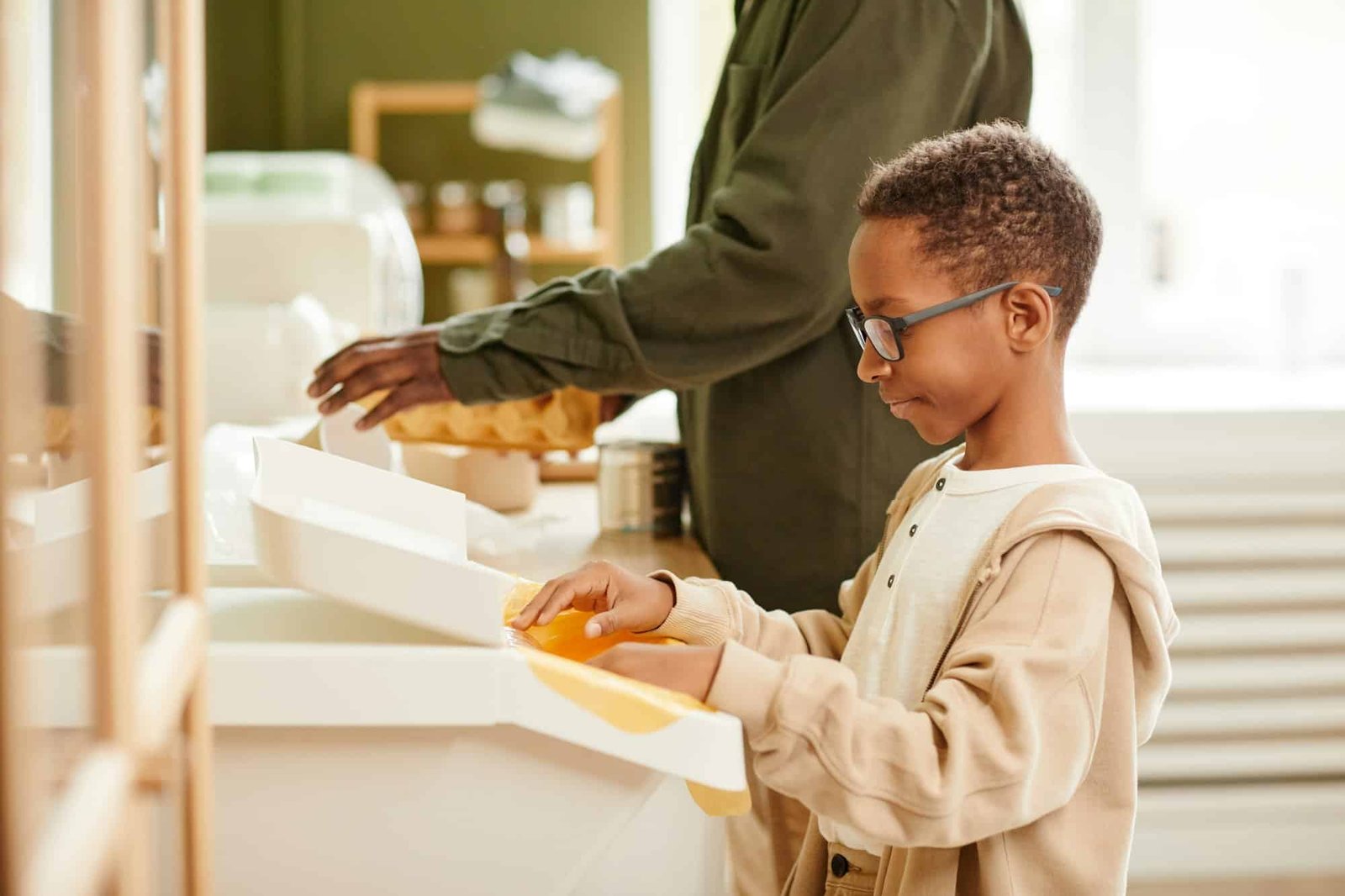 Boy Sorting Waste for Recycling